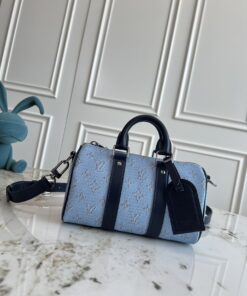 LV高仿藍色帆布圓筒包 小型手提斜背兩用設計