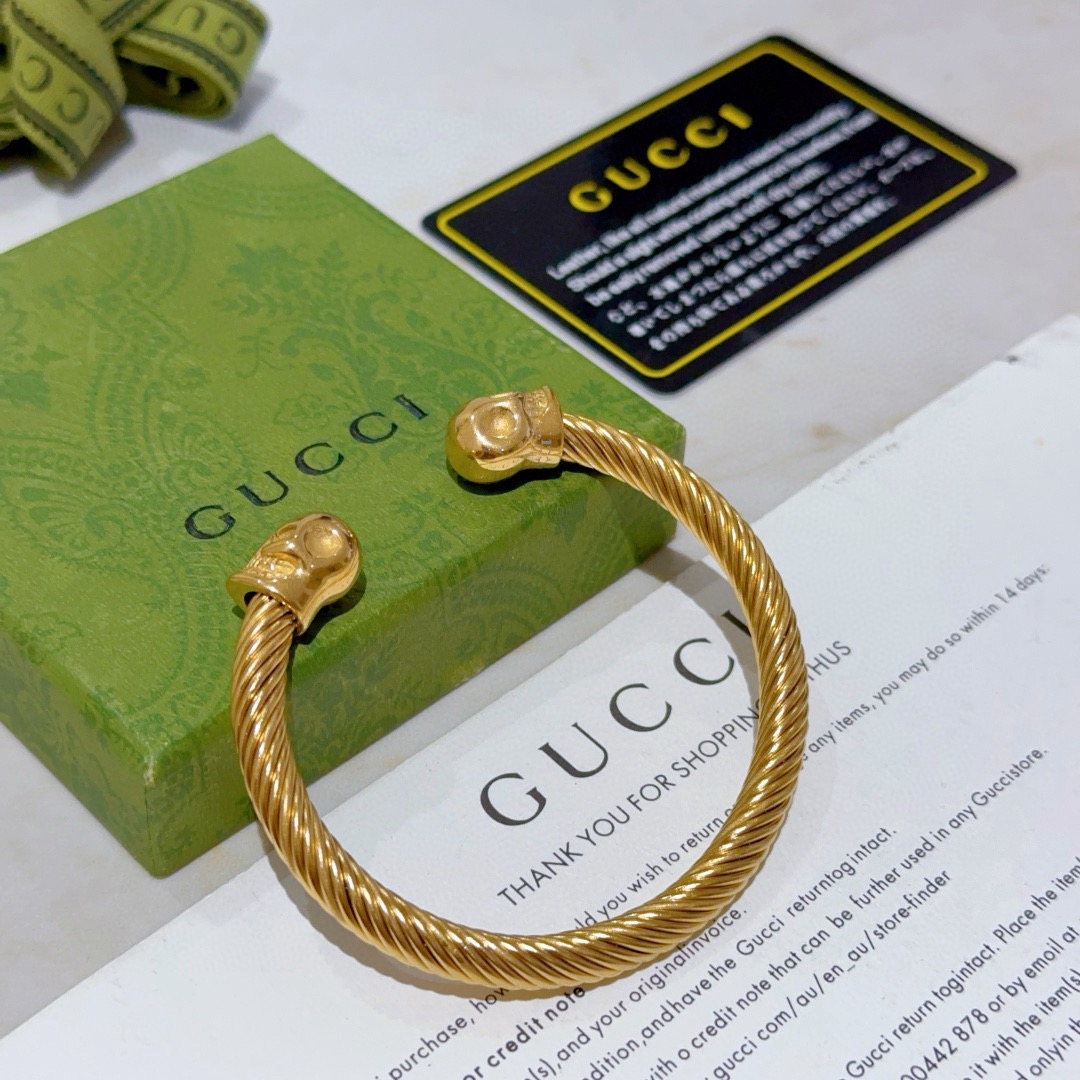 Gucci高仿金色骷髏雙頭手環 捲線雕刻設計金屬質感強烈