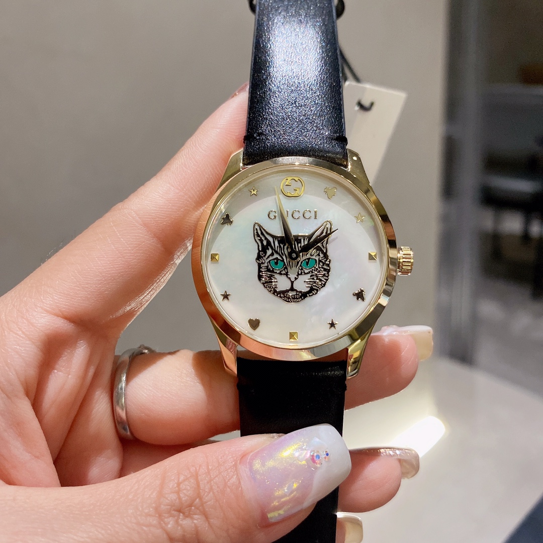 Gucci高仿G-Timeless貓眼女錶貝殼面黑皮錶帶限量風格款｜歐美奢侈品精品推薦