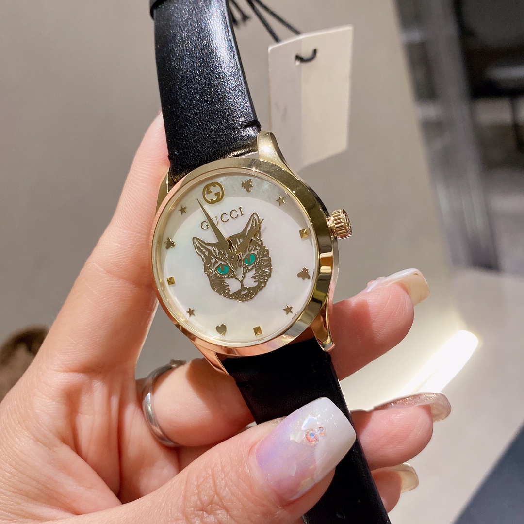 Gucci高仿G-Timeless貓眼女錶貝殼面黑皮錶帶限量風格款｜歐美奢侈品精品推薦
